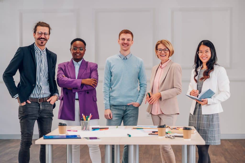 Multiracial business team in an office meeting during business coaching and development courses session
