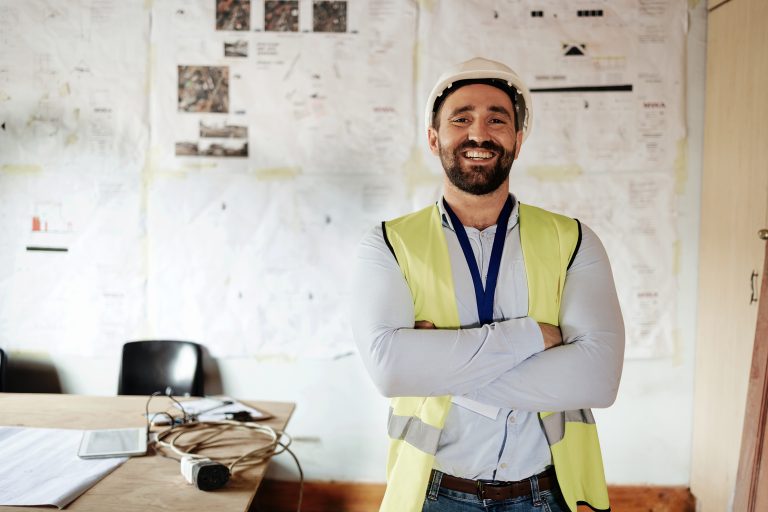 Engineer, technician or construction worker happy at work after completing a construction business growth training course