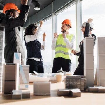 Positively fired-up and happy construction team