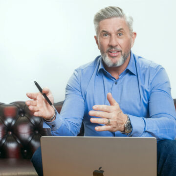 James Fleming working at his computer while preparing insights on executive coaching for leaders and the seven signs you may be ready.