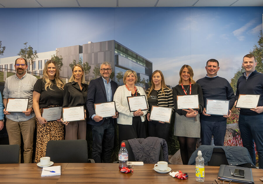 A group of Growth Leadership Graduates Celebrating Completion with their certificates