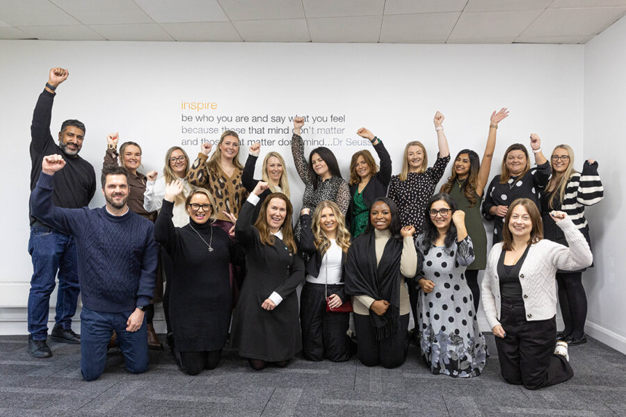Empowered Women Empower Women — Our Leadership Graduates from Redrow in Front of the Inspiring Wall Graphic