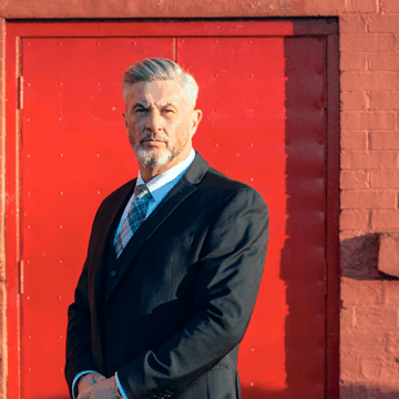 James Fleming image with red door background - Revealing the Truth of MQ Through Everyday Moments